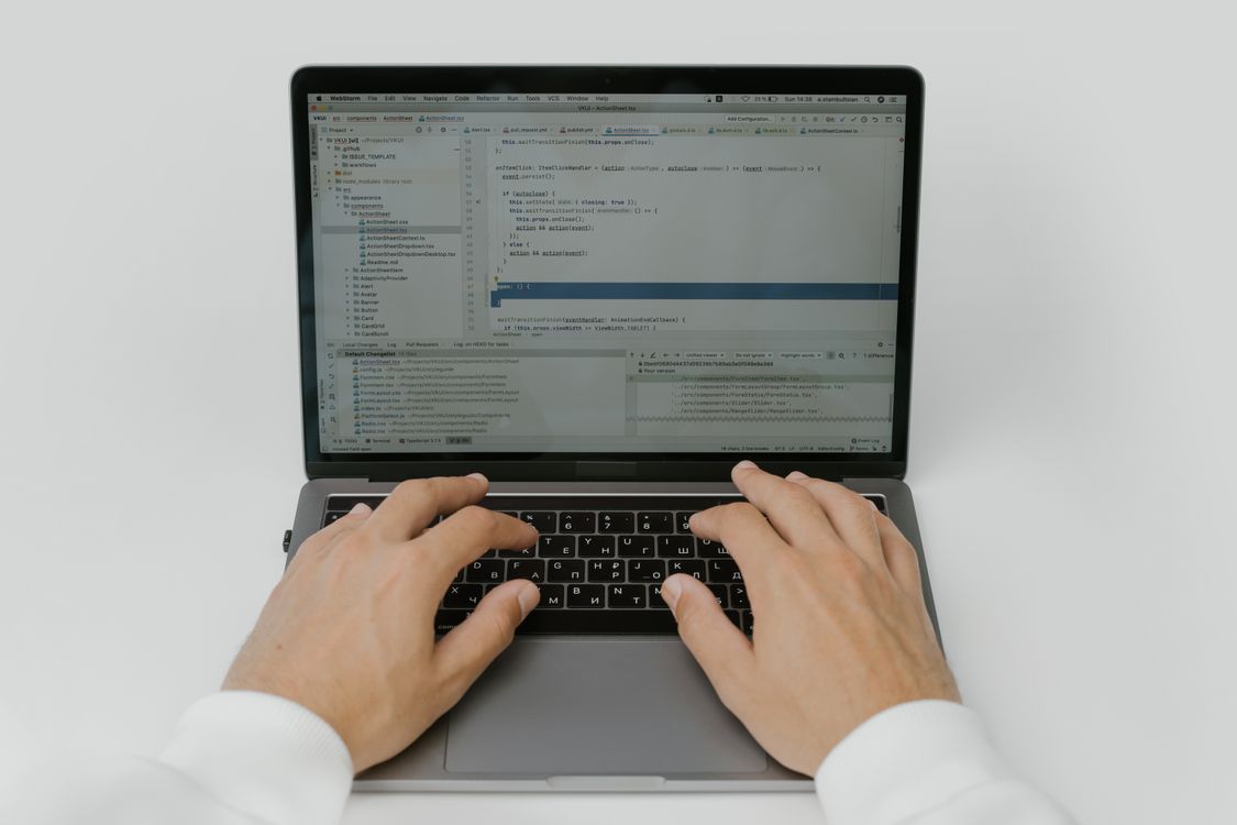Hands on laptop keyboard representing endpoint security for small business